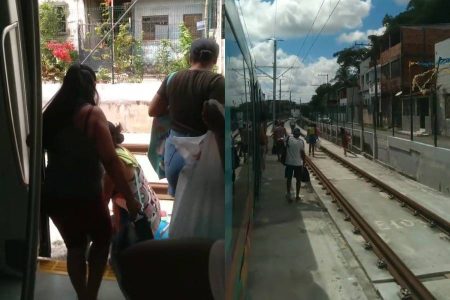 Após falha elétrica no VLT, passageiros caminham pelos trilhos
