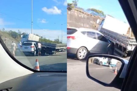 Carro fica preso sob caminhão após batida e causa congestionamento na BR-324, em Salvador
